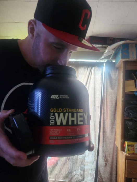 Me smelling a tub of gold standard whey protein. 