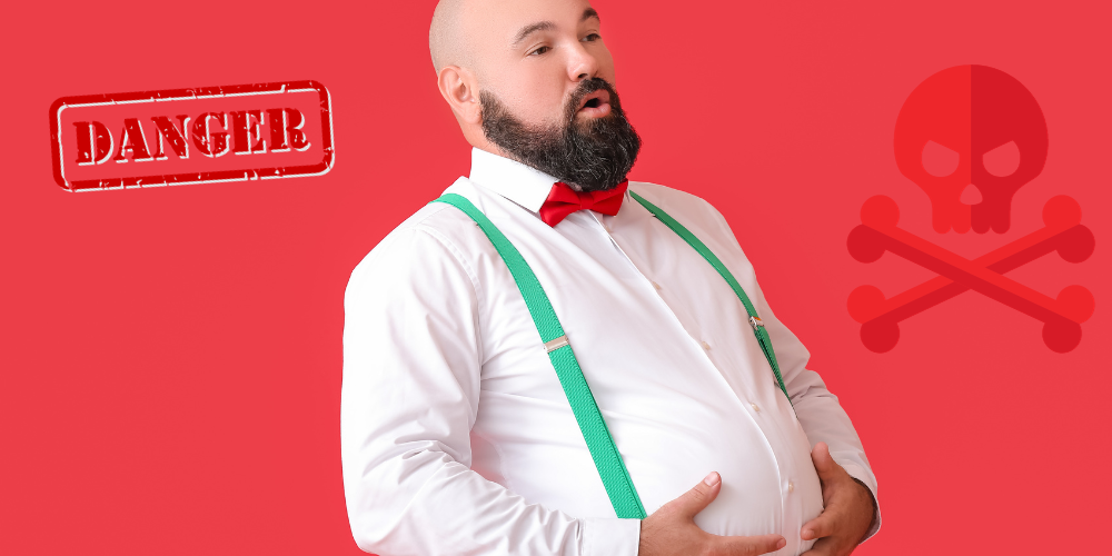 A guy wearing suspenders grabbing his big belly with a skull and cross bones and a danger sign.